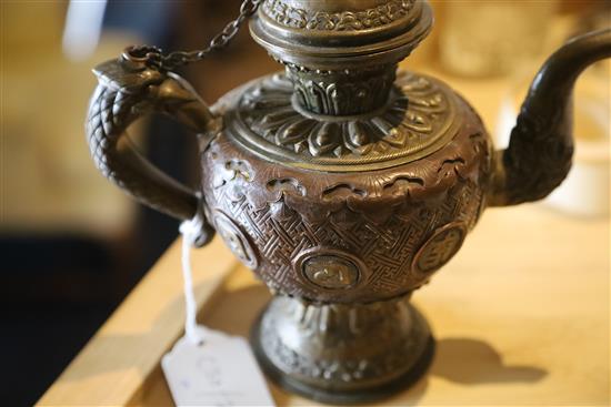 A Tibetan bronze and brass repousse work water sprinkler, 19th century, H. 21cm